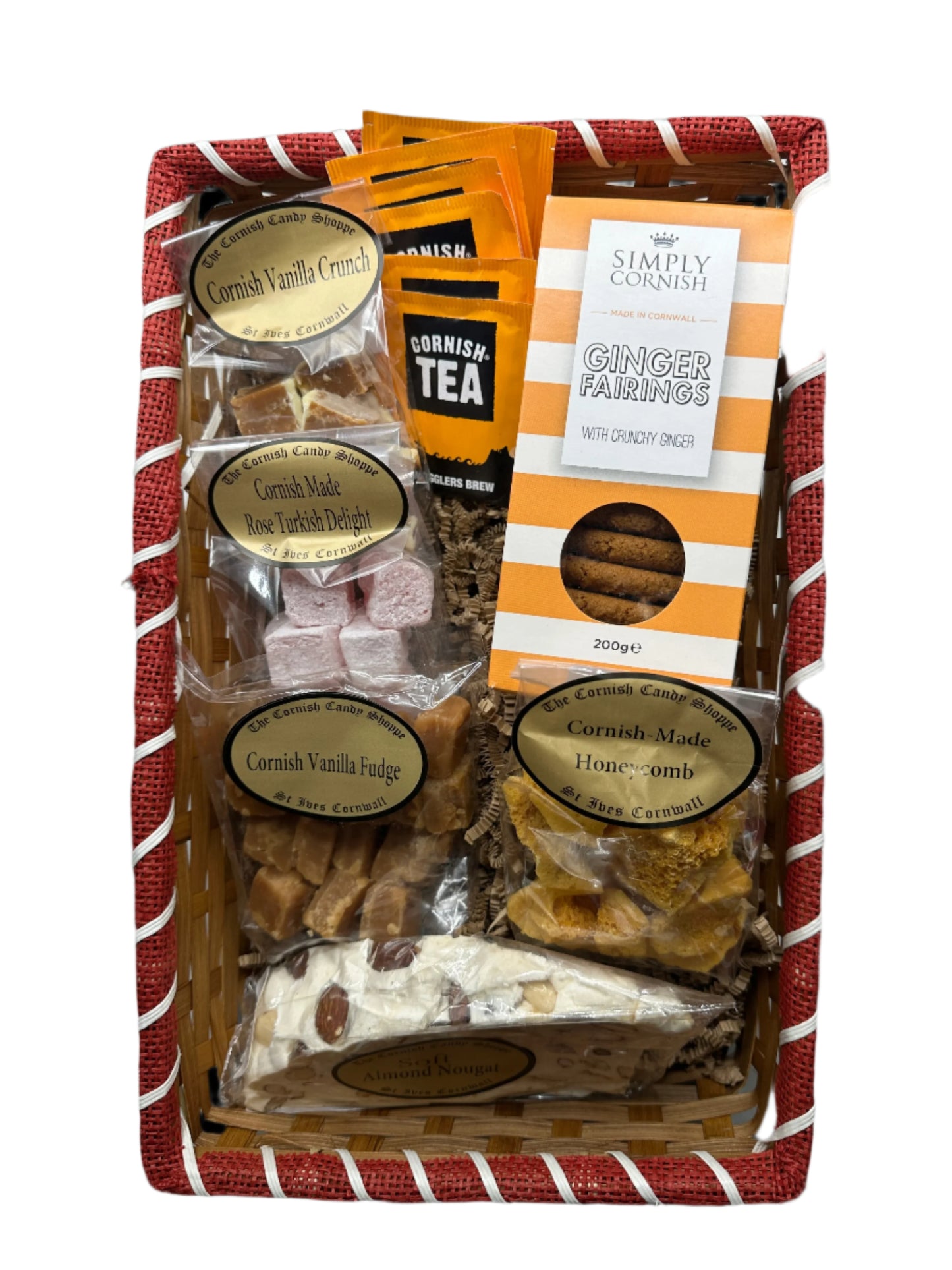 Large Cornish hamper gift filled with Cornish candy, fudge, tea, and ginger biscuits presented in a woven basket